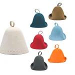 Zoe seamless one-piece molded felt sauna hats in various colors with a top loop design for spa and wellness businesses banner