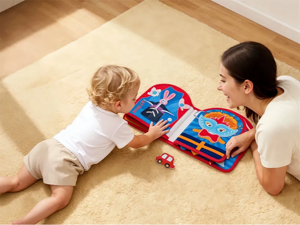 mother and child playing with a felt quiet book